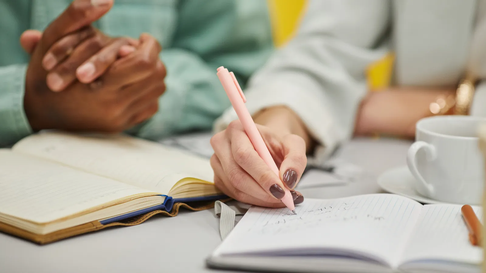 Hand writing in a notebook