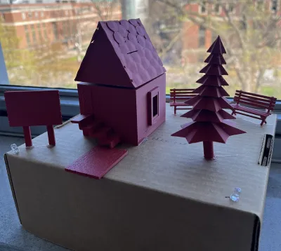 3D printed red cabin and trees